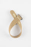 Light cream ribbed nylon watch strap displayed looped on a light grey background, featuring a brushed silver deployant clasp with an engraved logo. The strap includes a matching cream reinforced section with evenly spaced adjustment holes, highlighting its textured weave and clean, minimalist design.