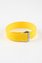 Close-up of a bright yellow ribbed nylon watch strap arranged in a loop on a light grey background. The strap features a textured woven surface and a brushed silver deployant clasp with an engraved logo. A matching yellow reinforced section with neatly stitched edges and evenly spaced adjustment holes is visible near the clasp, emphasizing the strap’s construction and vibrant color.