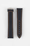 Two black textured watch strap pieces with orange contrast stitching displayed side by side on a light grey background; one strap is attached to a brushed silver deployant clasp with an engraved logo, while the other features a row of adjustment holes.