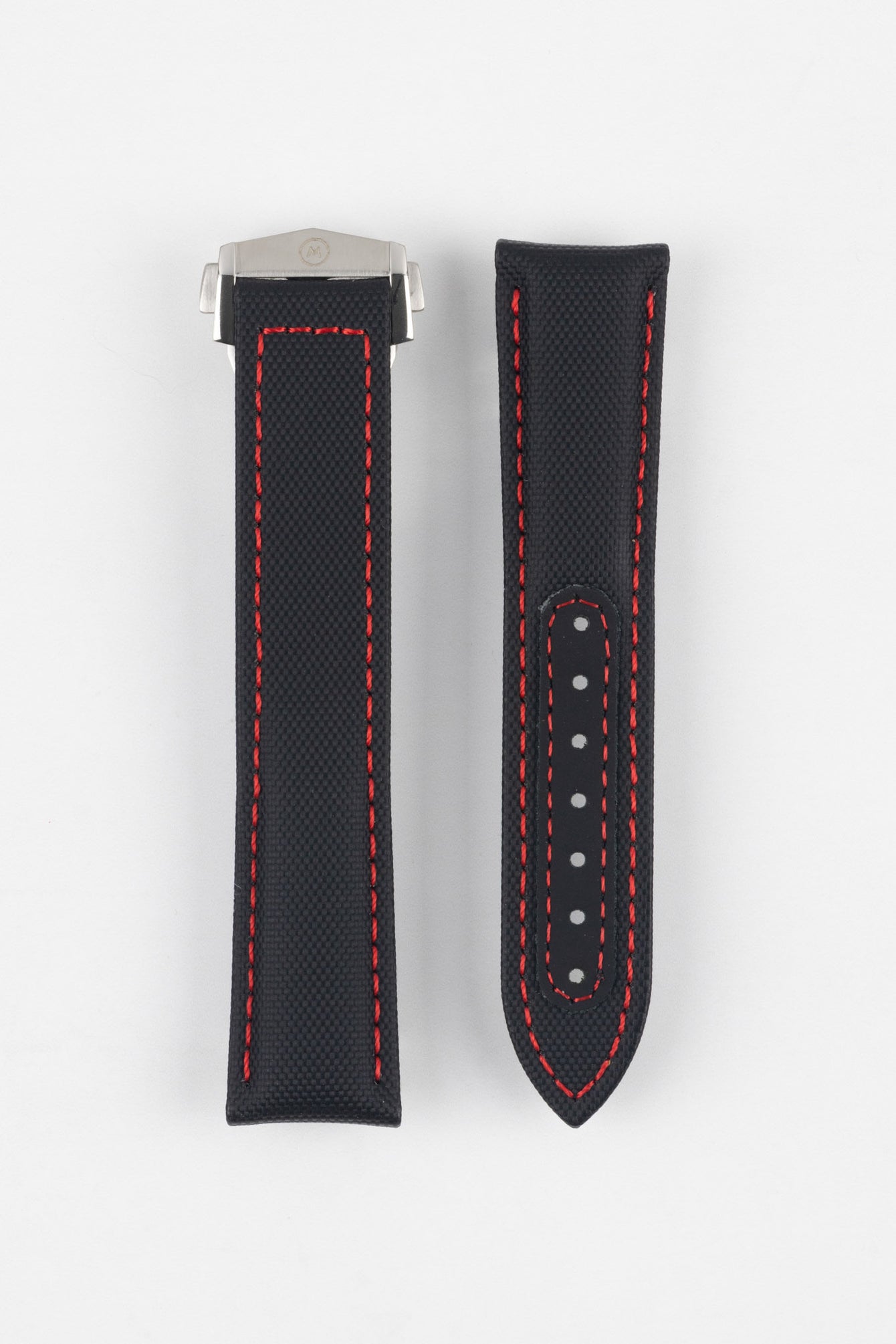 Two black textured watch strap pieces with red contrast stitching displayed side by side on a light grey background; one strap is attached to a brushed silver deployant clasp with an engraved logo, while the other features a row of adjustment holes.