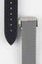Two grey textured watch strap pieces displayed vertically on a light grey background, featuring subtle light grey stitching; one strap is fitted with a brushed silver deployant clasp with an engraved logo, while the other shows a row of evenly spaced adjustment holes down the center.