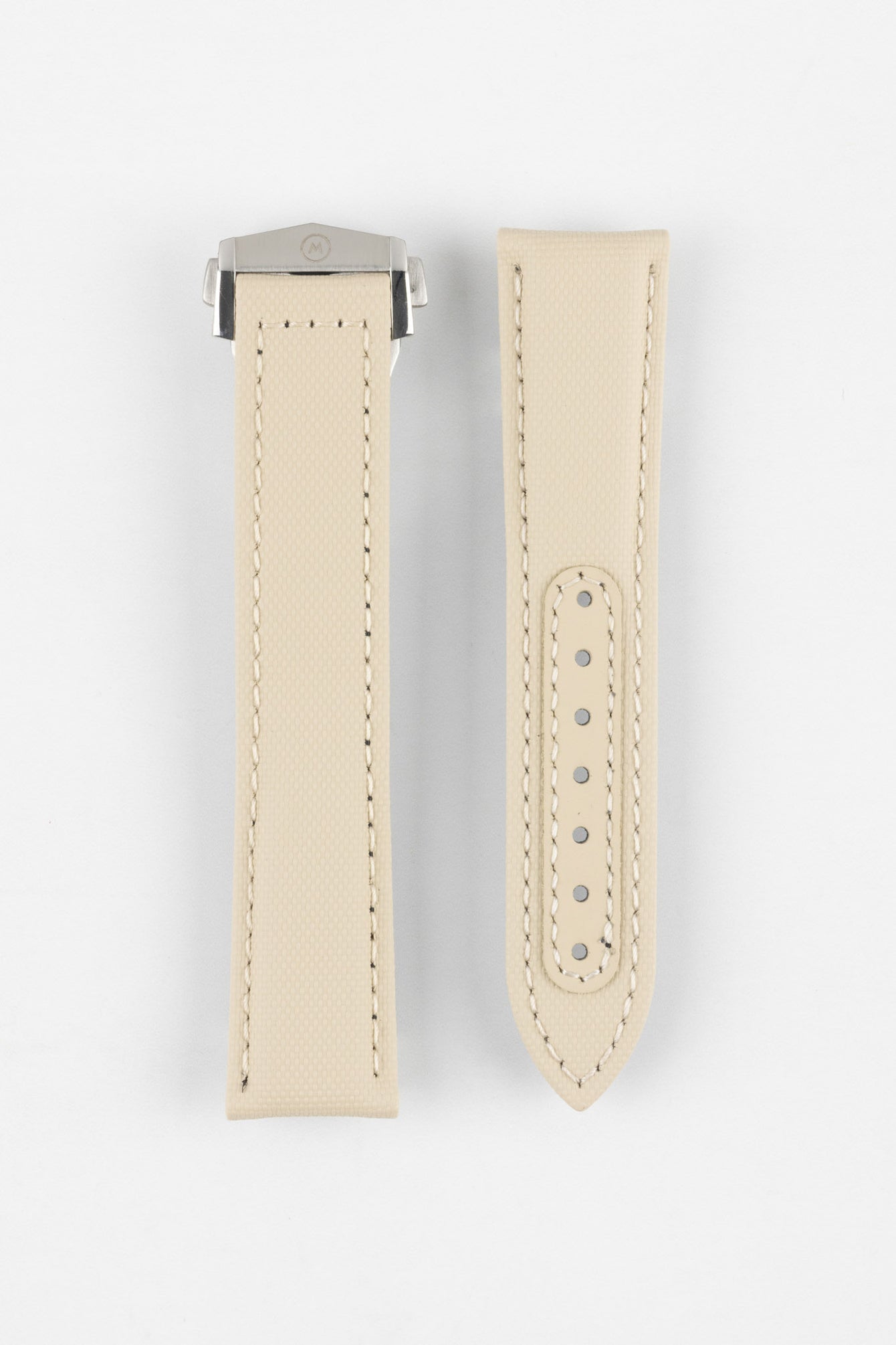 Two sand-colored textured watch strap pieces displayed vertically on a light grey background, featuring matching light stitching; one strap is fitted with a brushed silver deployant clasp with an engraved logo, while the other shows a row of evenly spaced adjustment holes along the center.