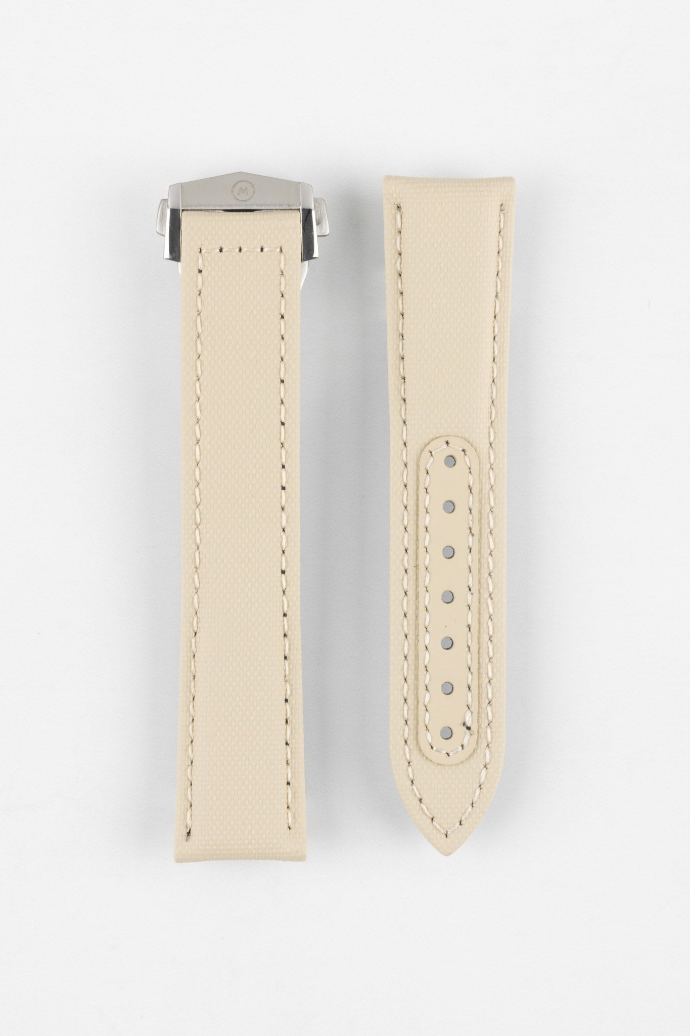 Two sand-colored textured watch strap pieces displayed vertically on a light grey background, featuring matching light stitching; one strap is fitted with a brushed silver deployant clasp with an engraved logo, while the other shows a row of evenly spaced adjustment holes along the center.