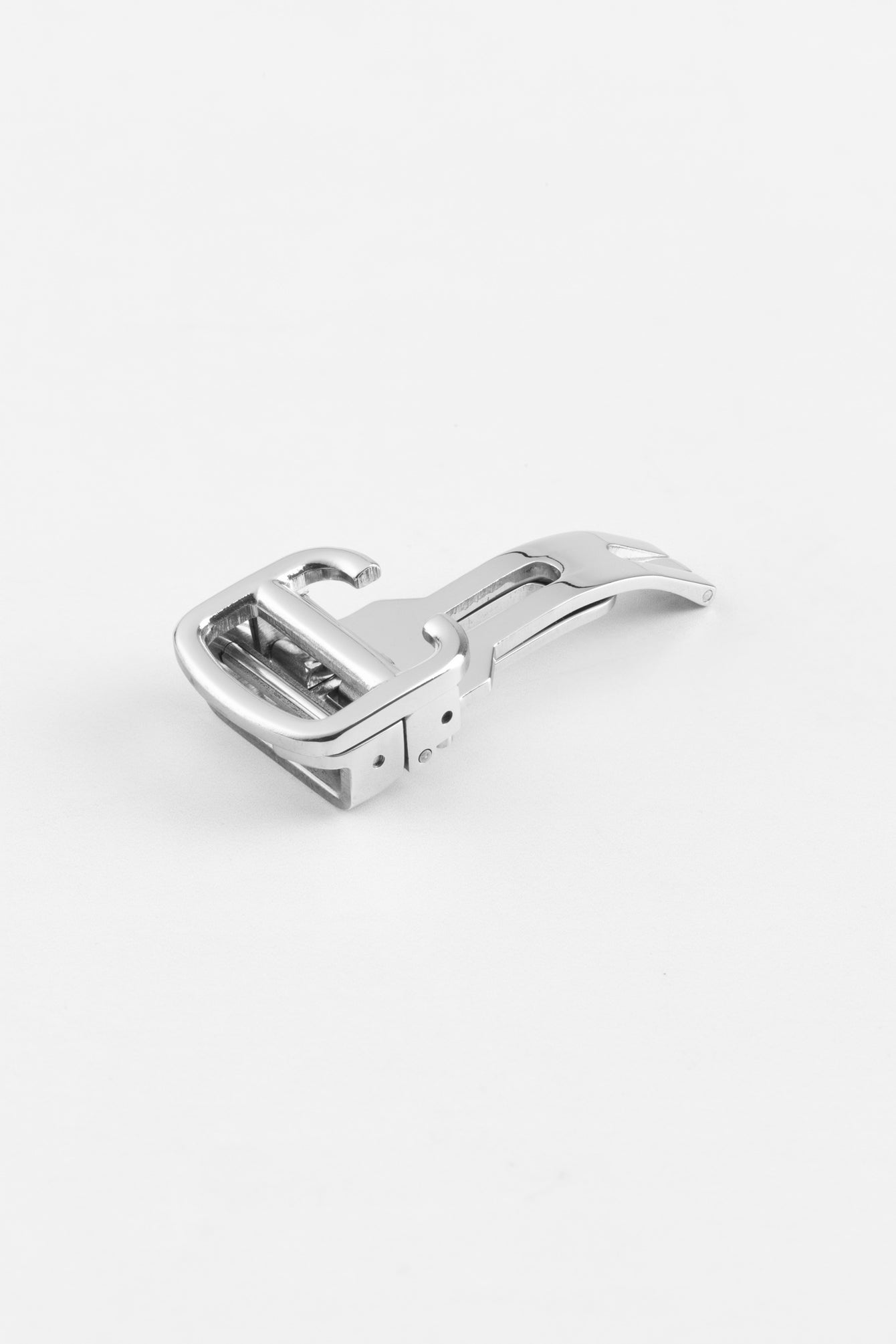 A polished silver-colored deployant clasp, partially folded, displayed on a white background. The clasp has a sleek design with rounded edges.