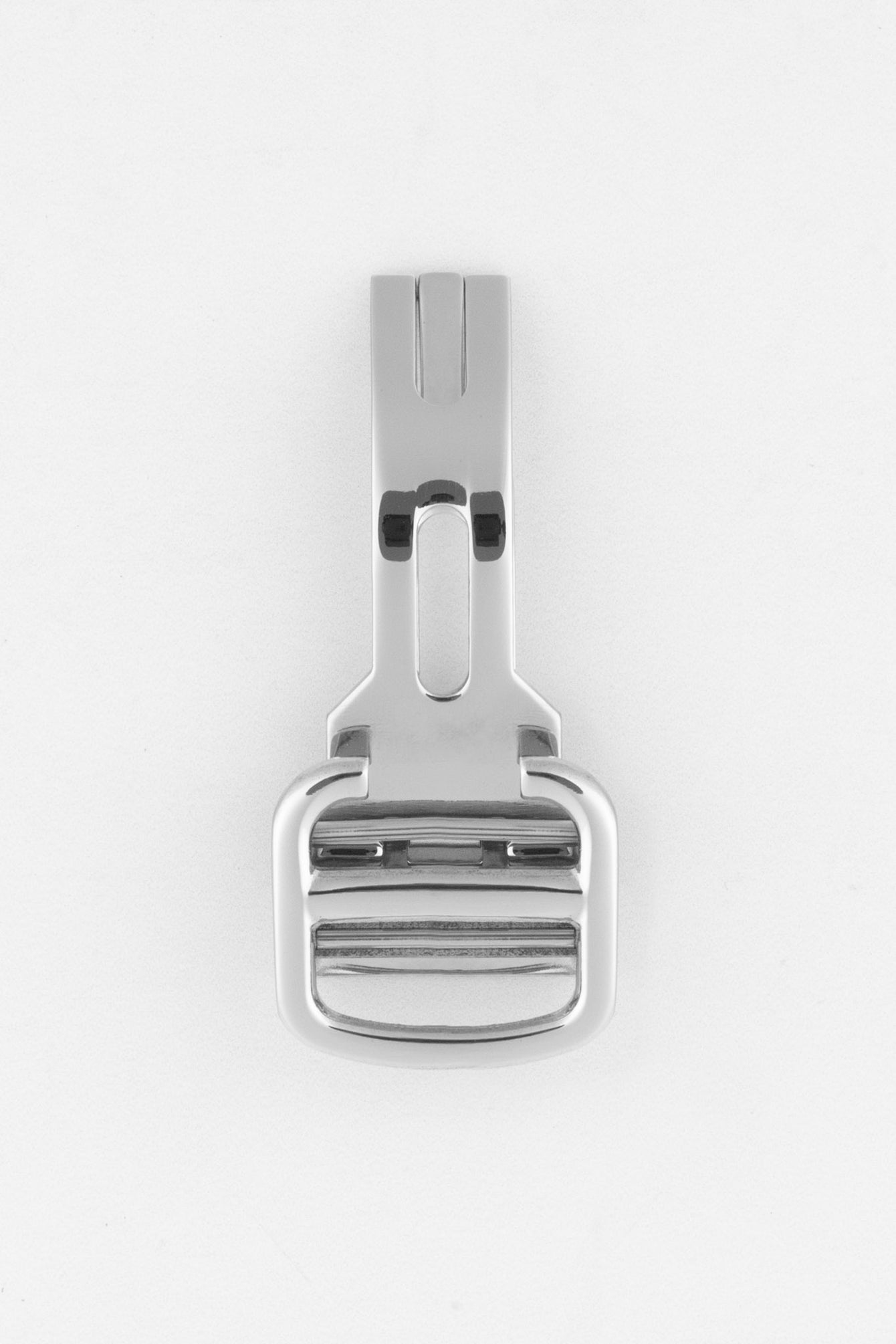 A top-down view of a polished silver-colored deployant clasp, in its closed position, on a white background. The rectangular top piece with two horizontal lines is prominent.