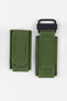 Olive green hook-and-loop watch strap with a woven nylon construction and black attachment loop, displayed on a white background.
