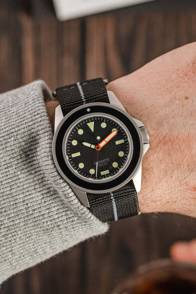 Unimatic Modello Uno U1-MLB Edition of 200 fitted with Erika's Originals Black Ops watch strap in full black with grey centerline worn on wrist