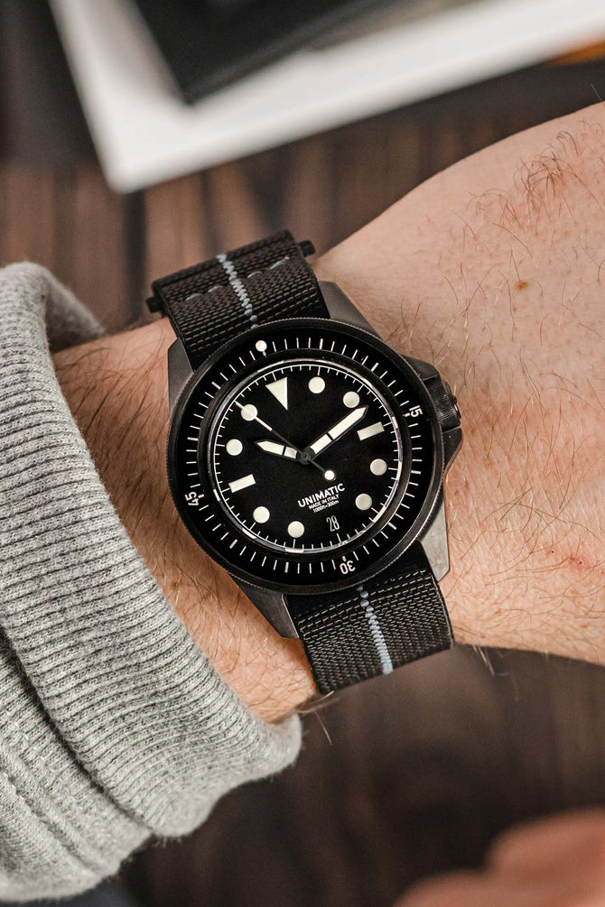 Unimatic Modello Uno U1-FDN Watch in Matte Black fitted with Erika's Originals Black Ops strap in full black with grey centerline worn on wrist