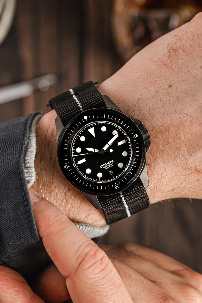 Unimatic Modello Uno U1-FDN Watch in Matte Black fitted with Erika's Originals Black Ops strap in full black with lumed centerline onworn on wrist