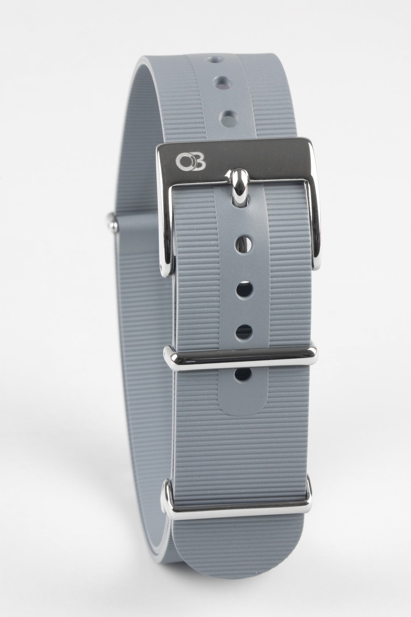 Light grey bonetto cinturini 328 rubber one piece watch strap buckled and curved featuring logo embossed buckle
