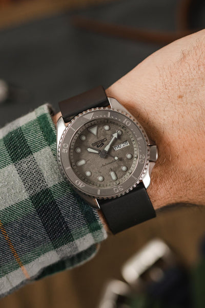 Seiko 5 Sport Cement SRPG61K1 with Black Bonetto Cinturini 270 watch strap on wrist with flannel shirt