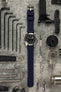 Tudor Black Bay Steel M79730-0005 with Bonetto Cinturini 317 rubber watch strap flat on work table with tools