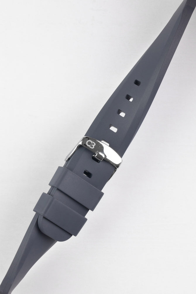 Dark grey bonetto cinturini 317 rubber watch strap buckled and twisted to show flexibility 