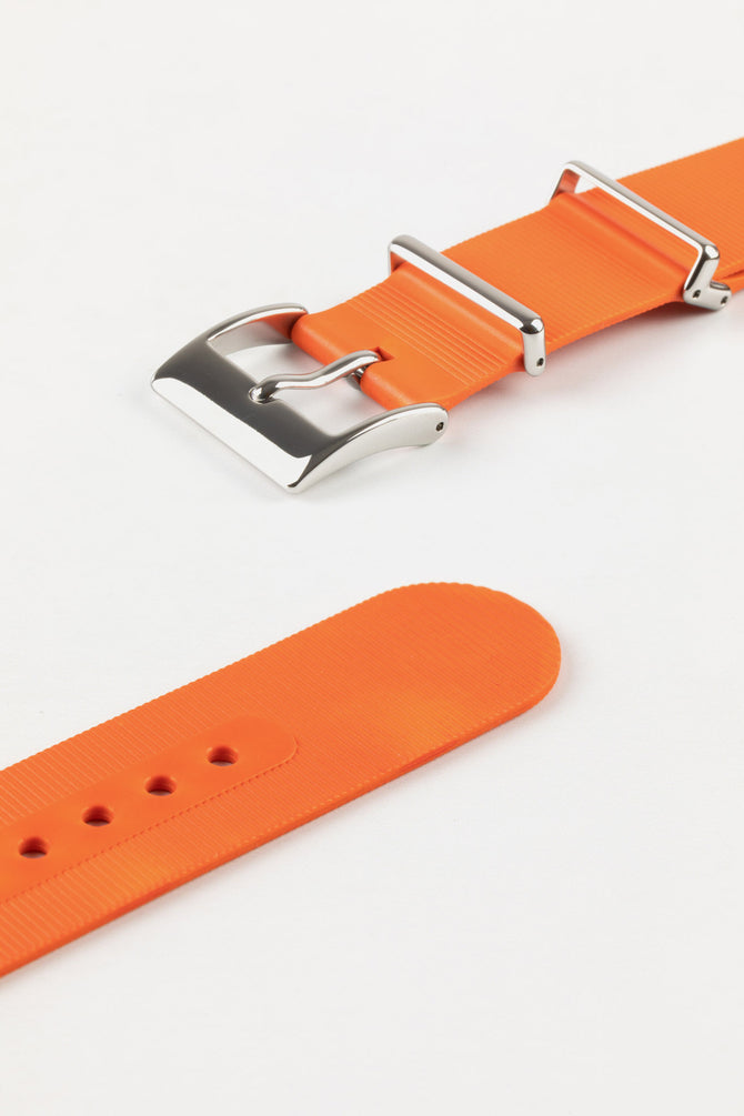 Buckle and adjustment holes of bonetto centurini 328 one piece rubber orange watch strap with polished stainless steel buckle