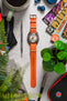 Doxa sub 300 searambler silver lung limited edition fitted with orange bonetto cinturini 328 premium rubber one piece watch strap flat on table