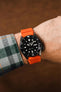 Faded Orange Bonetto Centurini 284 Rubber Strap fitted to Seiko 5 Sports SRPD55K3 strap on wrist with flannel shirt
