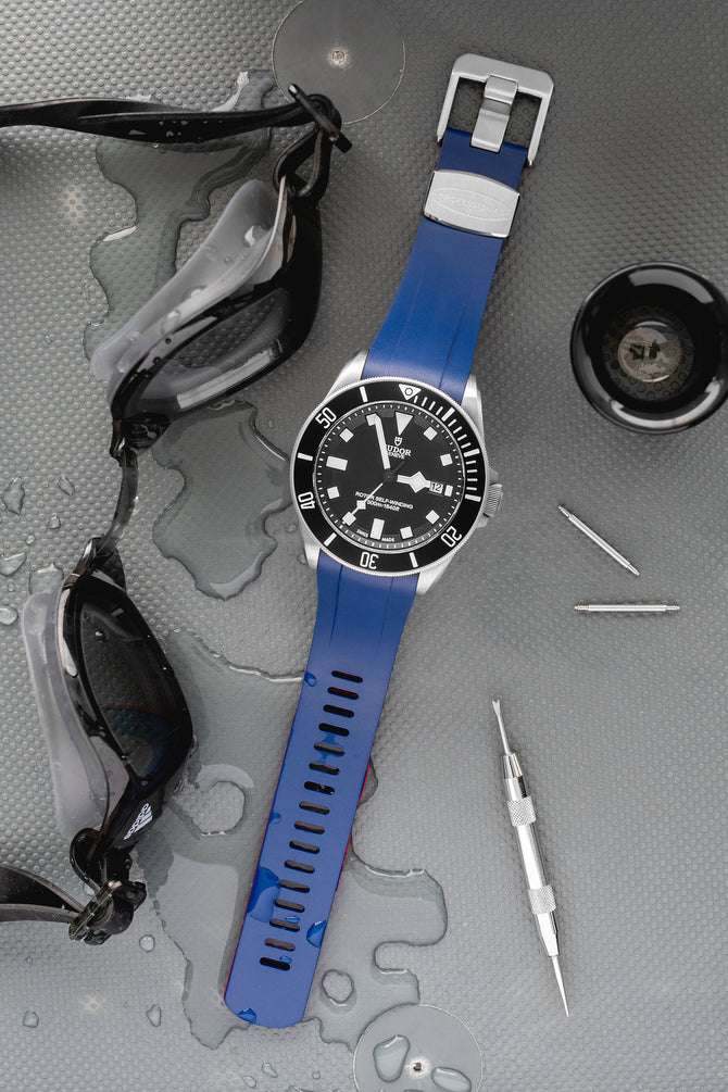 Tudor Pelagos Black dial and bezel fitted with crafter blue TD02 Rubber watch strap in blue with brushed stainless steel buckle lying flat