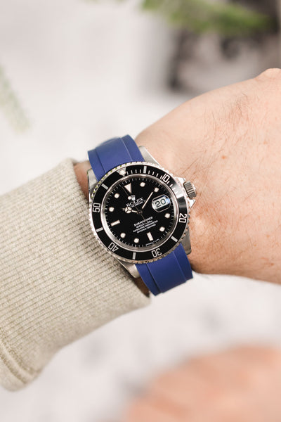 Rolex Submariner 16610 Oystersteel black dial and bezel fitted with Crafter Blue RX01 strap in blue worn on wrist
