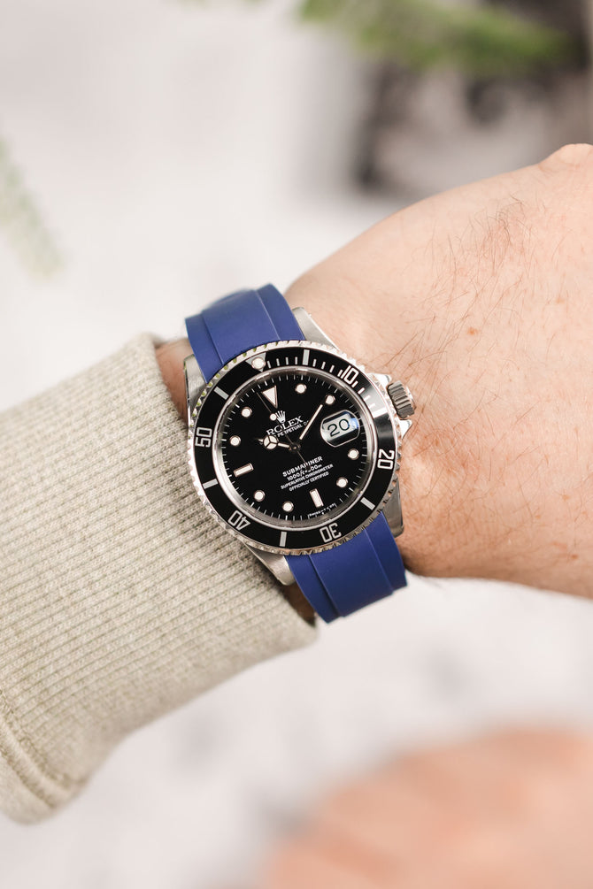 Rolex Submariner 16610 Oystersteel black dial and bezel fitted with Crafter Blue RX01 strap in blue worn on wrist