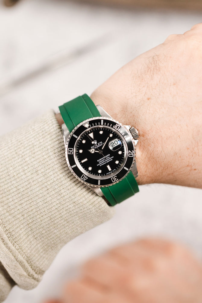 Rolex Submariner 16610 Oystersteel black dial and bezel fitted with green crafter blue rx01 worn on wrist