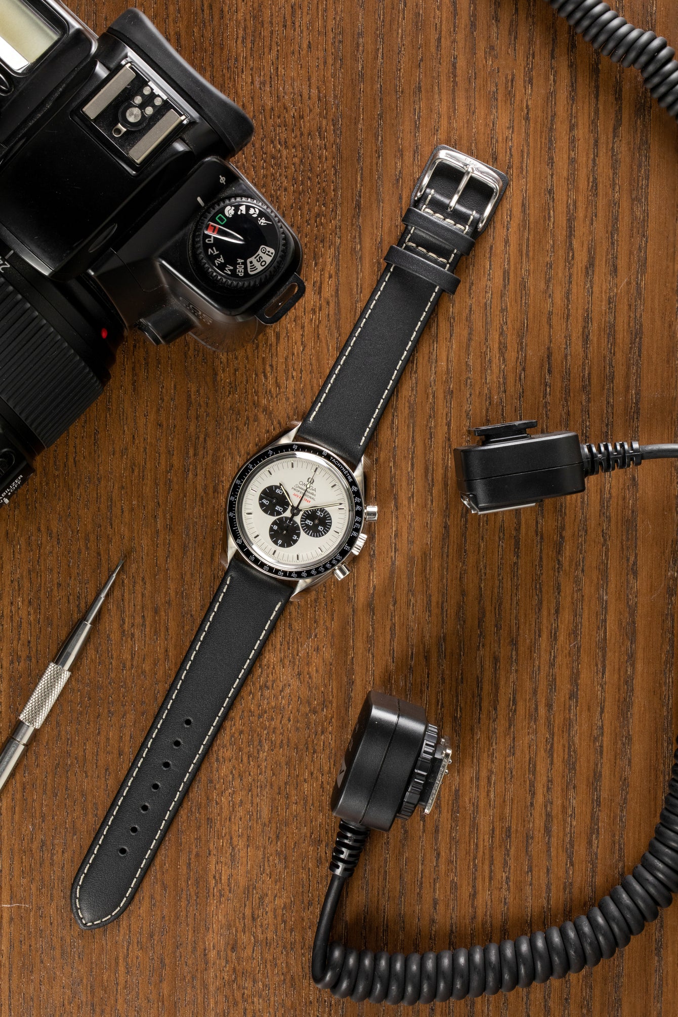 Omega Speedmaster moonwatch Apollo 11 fitted with di-modell denver calf leather watch strap in black with beige stitch