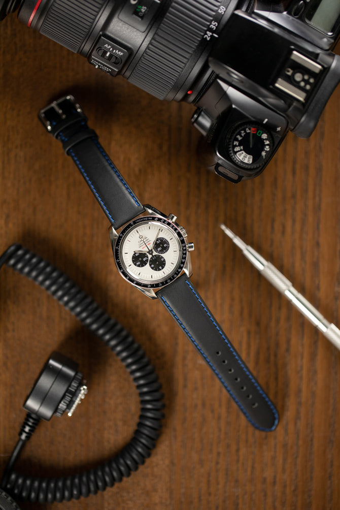 Omega Speedmaster moonwatch Apollo 11 fitted with di-modell denver calf leather watch strap in black with blue stitch