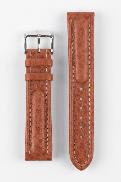 Upperside of Di-Modell Polo Sherpa waterproof leather watch strap with polished stainless steel embossed buckle in gold brown