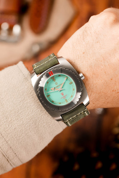 turquoise dial watch (on wrist)