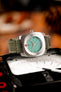 turquoise dial watch