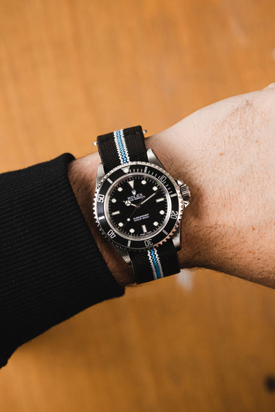 Rolex Submariner Oystersteel 41mm Black Dial fitted with Erika Originals Corsa Strap with Turquoise centreline worn on wrist
