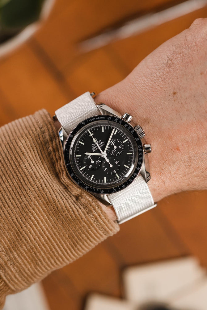 Speedmaster Moonwatch Professional black dial fitted with Erika's Originals NASA MN watch strap in full white on wrist