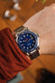 Omega Seamaster 300 blue dial fitted with Forstner Flat Link stainless steel bracelet in polished and brushed worn on wrist