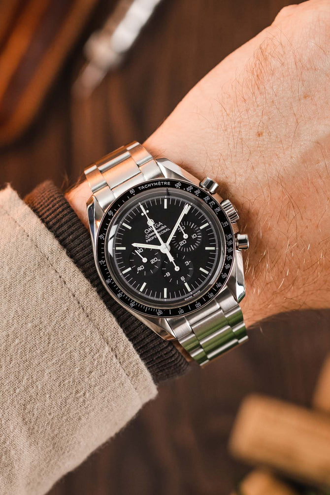 Omega Speedmaster Moonwatch Black Dial fitted with Forstner Model O Oyster-Style watch bracelet brushed finish worn on wrist