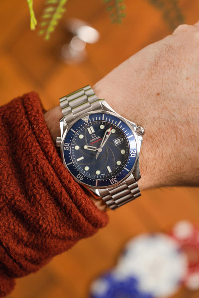 Omega Seamaster Bond 300 Blue Dial fitted with Forstner President stainless steel brushed watch bracelet worn on wrist