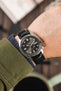 Seiko 5 Sports Anthracite dial fitted with Hirsch Accent Rubber Strap in Black on wrist with green shirt