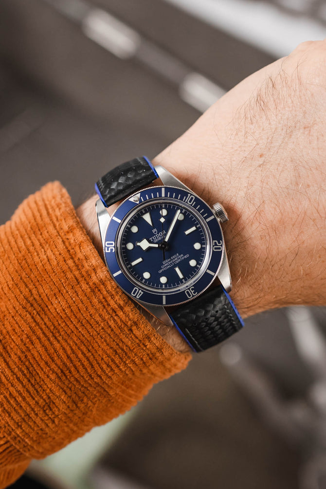 Tudor Black Bay 58 Blue fitted with Hirsch Ayrton Black and blue Carbon embossed watch strap worn on wrist