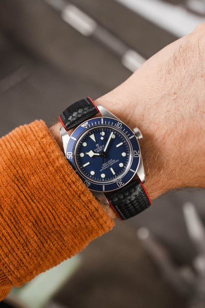 Tudor Black Bay 58 Blue fitted with Hirsch Ayrton Black and red Carbon embossed watch strap worn on wrist