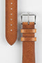 A close-up of a gold brown Hirsch BAGNORE Vintage Calf Leather Quick-Release Watch Strap.