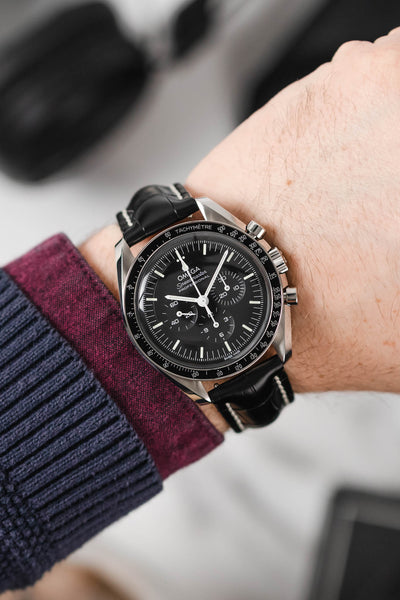 Black mega Speedmaster Moonwatch fitted with Hirsch Capitano black leather strap worn on wrist