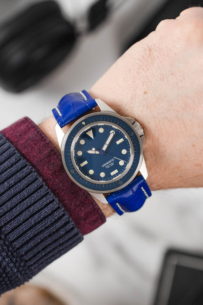 Blue Unimatic U1 fitted with Hirsch Capitano Royal Blue leather watch strap worn on wrist