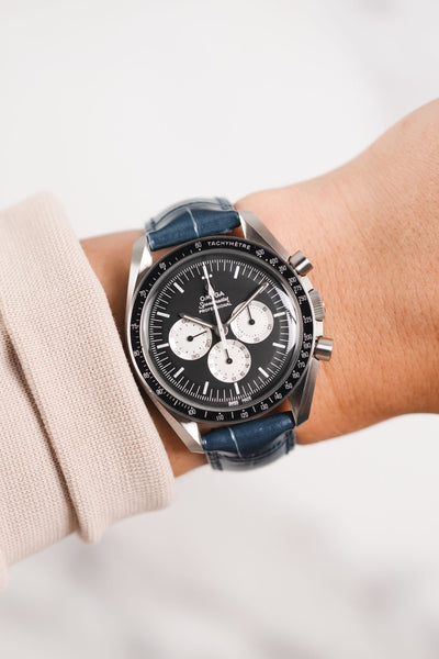 Omega Speedmaster Moonwatch Panda Chronograph fitted with Hirsch Duke Metallic blue leather watch strap worn on wrist