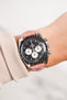 Omega Speedmaster Moonwatch Panda Chronograph fitted with Hirsch Duke Metallic rose leather watch strap worn on wrist