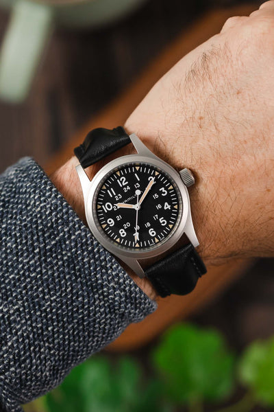 Hamilton Khaki Field watch fitted with Hirsch Calfskin leather Black Watch Strap worn on wrist