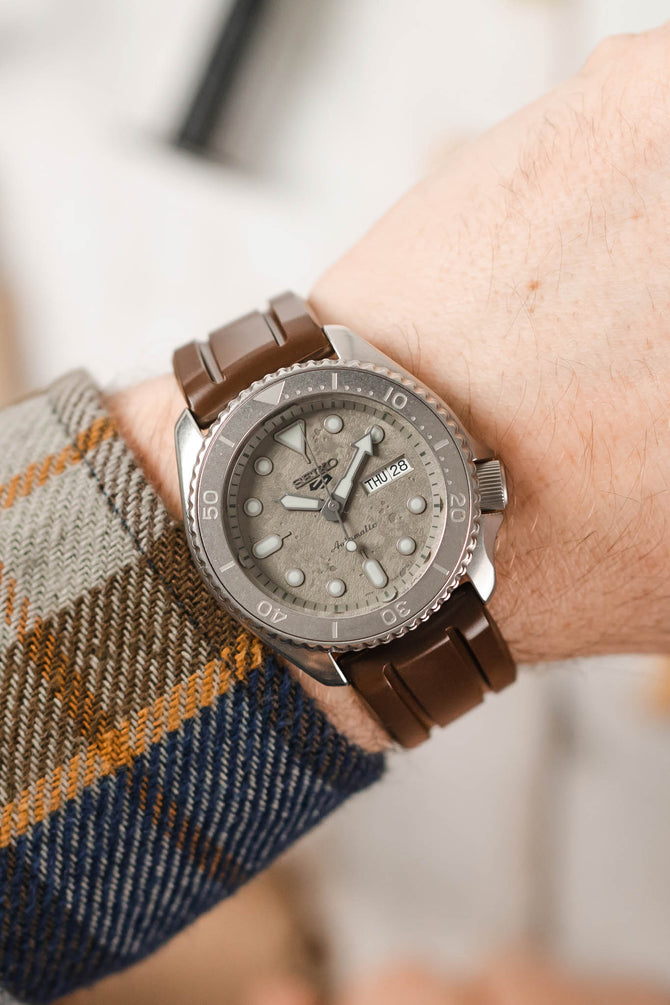 Seiko 5 Sports concrete grey fitted with Hirsch Hevea Brown Rubber watch strap worn on wrist