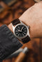 Hamilton Khaki field watch fitted with Hirsch James brown leather watch strap worn on wrist
