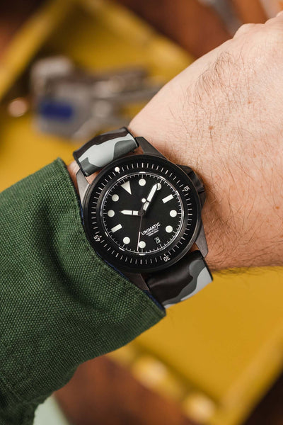 Black Unimatic U1 fitted with Hirsh John Camo Grey Rubber watch strap worn on wrist