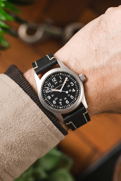 Hamilton Khaki Field Watch fitted with Hirsch Liberty Black Leather watch strap worn on wrist 
