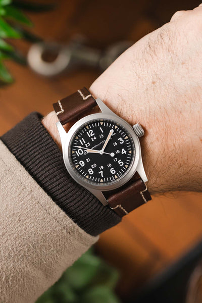 Hamilton Khaki Field Watch fitted with Hirsch Liberty brown Leather watch strap worn on wrist
