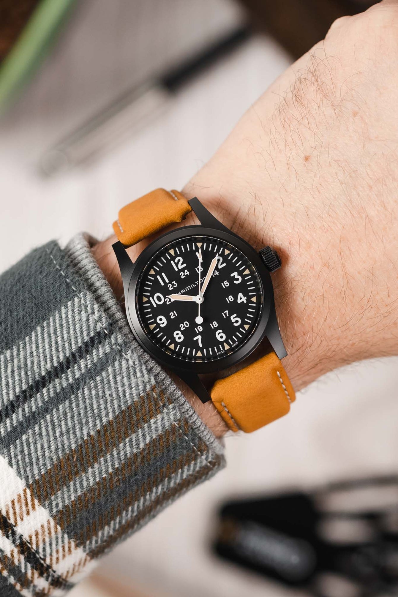 Hamilton Khaki Field Watch fitted with Hirsch Mariner gold brown leather watch strap worn on wrist