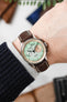 Studio Underd0g Mint Choc chip fitted with Hirsch Modena Alligator Brown leather watch strap worn on wrist